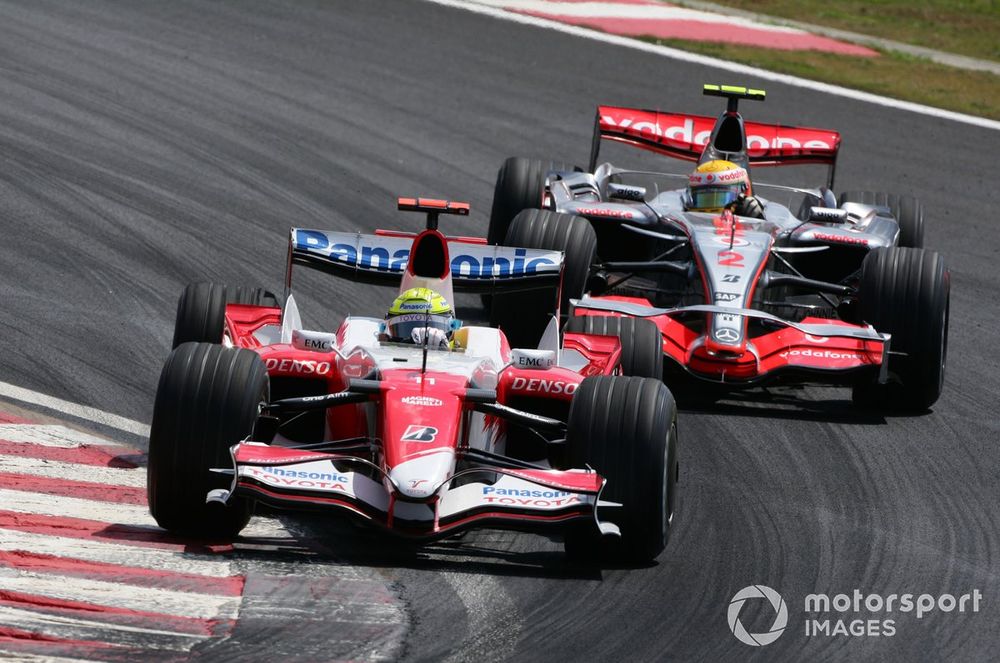 Ralf Schumacher, Toyota TF107, 11th position, leads Lewis Hamilton, McLaren MP4-22 Mercedes, 7th position. 