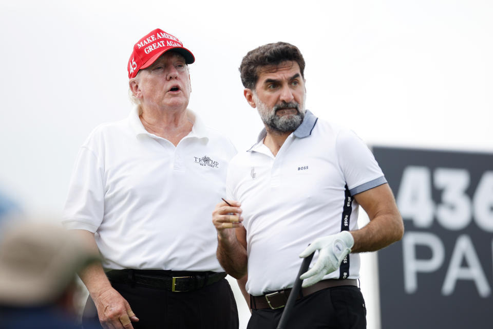 Donald Trump and Yasir Al-Rumayyan during a LIV pro-am at Trump Bedminster in 2022. (Cliff Hawkins/Getty Images)