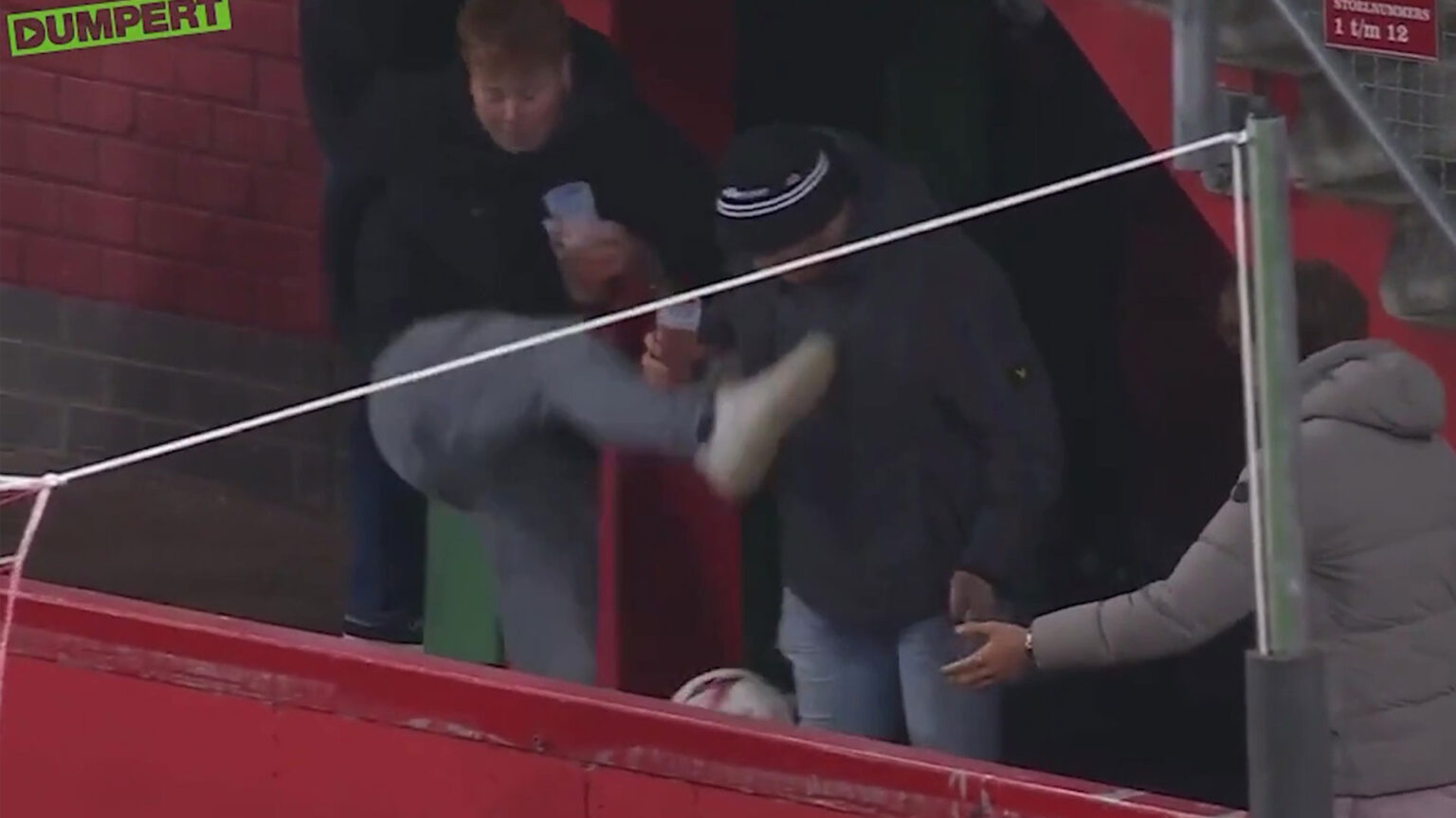 Excruciating moment fan kicks his mate’s beer out of his hands on live TV at Europa League clash