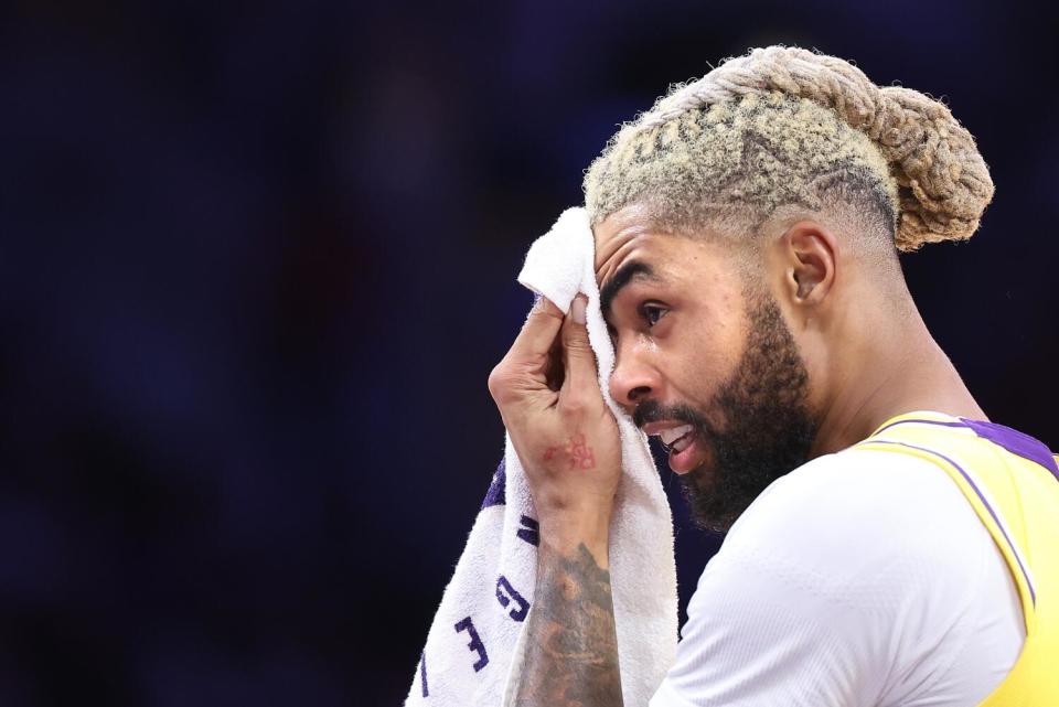 Laker D'Angelo Russell wiped his face with a towel during his team's win Friday night at Crypto.com Arena.