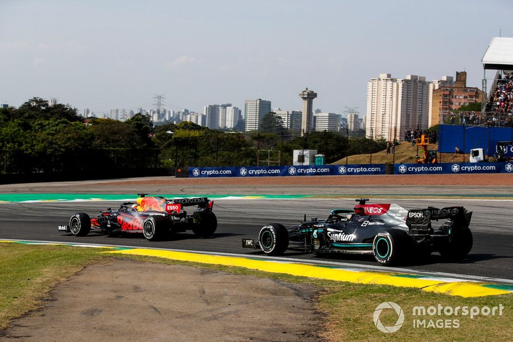 Max Verstappen, Red Bull Racing RB16B, battles with Lewis Hamilton, Mercedes W12