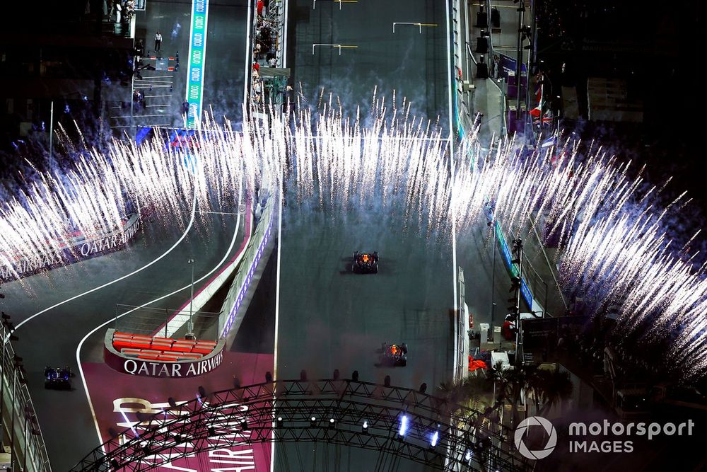 Max Verstappen, Red Bull Racing RB20, 1st position, Sergio Perez, Red Bull Racing RB20, 2nd position, drive up the grid after the finish