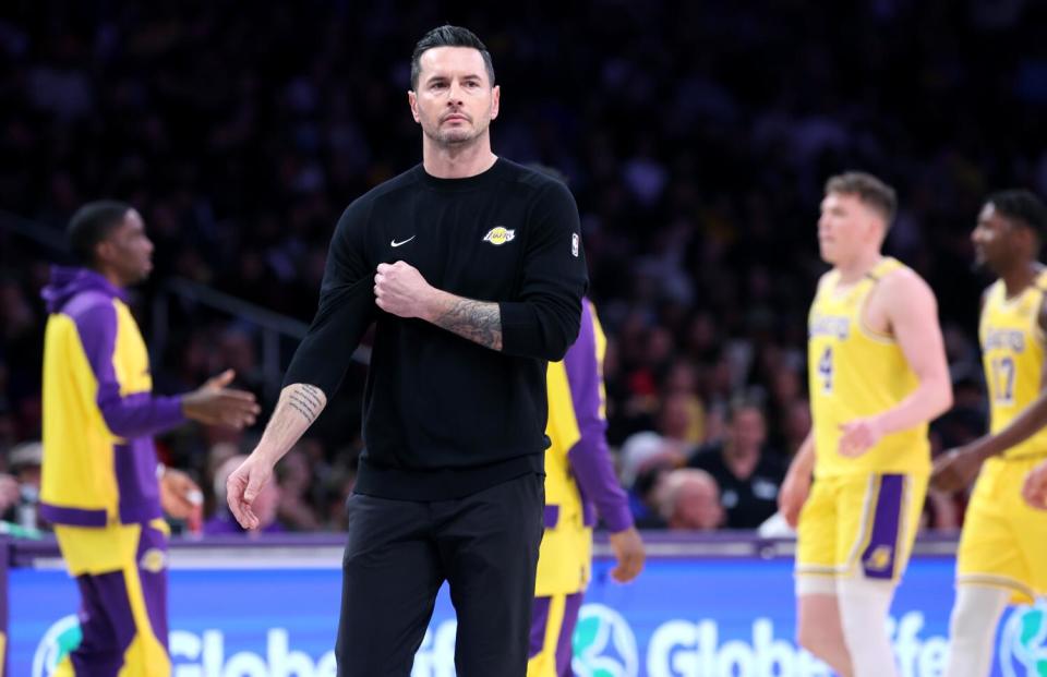 Lakers coach JJ Redick looks across the court during a game against the Cavaliers at Crypto.com Arena Tuesday.