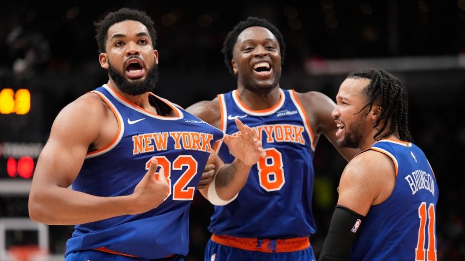 New York Knicks guard Jalen Brunson (11) and forward OG Anunoby (8) react after a three point basket by center Karl-Anthony Towns (32) to clinch a win over the Toronto Raptors during the second half at Scotiabank Arena.