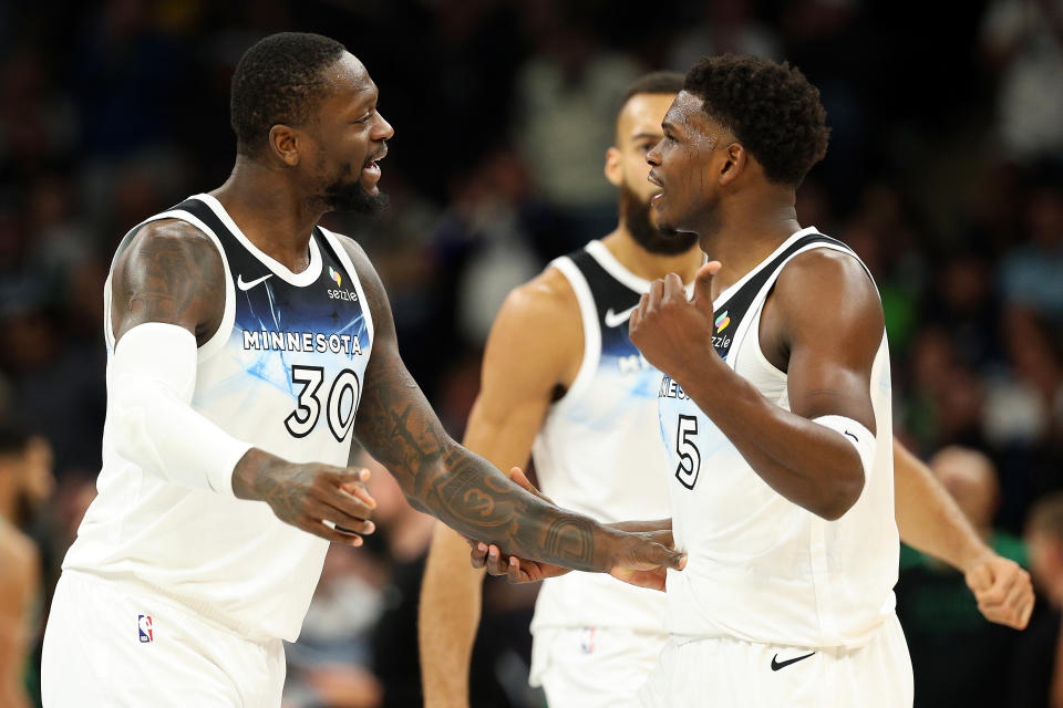 MINNEAPOLIS, MINNESOTA - JANUARY 02: Julius Randle #30 (L) of the Minnesota Timberwolves interacts with teammate Anthony Edwards #5 in the third quarter against the Boston Celtics at Target Center on January 02, 2025 in Minneapolis, Minnesota. The Celtics defeated the Timberwolves 118-115. NOTE TO USER: User expressly acknowledges and agrees that, by downloading and or using this photograph, User is consenting to the terms and conditions of the Getty Images License Agreement. (Photo by David Berding/Getty Images)