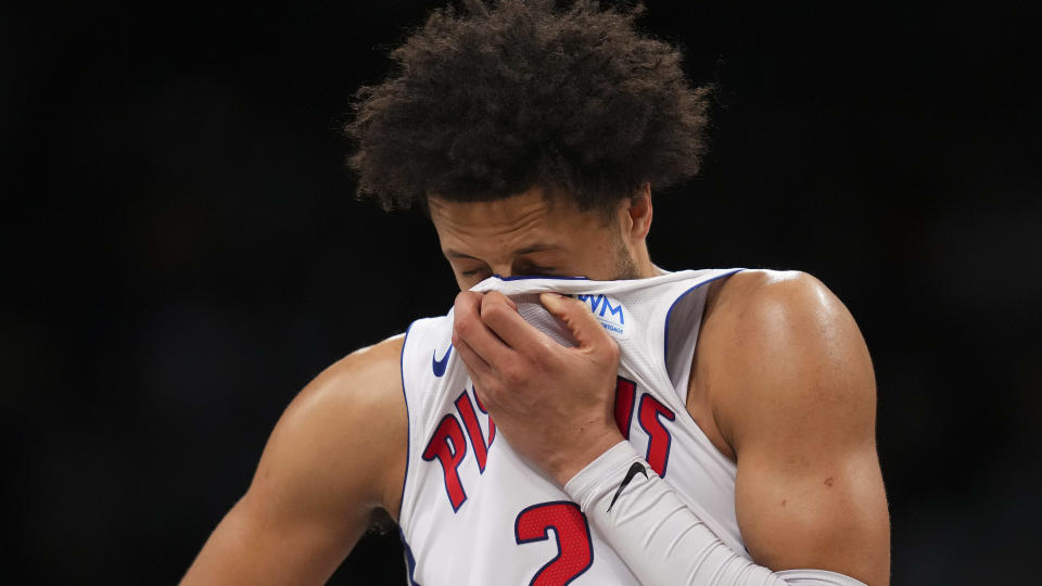 NEW YORK, NEW YORK - DECEMBER 23: Cade Cunningham #2 of the Detroit Pistons wipes his face against the Brooklyn Nets in the second half at Barclays Center on December 23, 2023 in the Brooklyn borough of New York City. The Nets defeated the Pistons 126-115. NOTE TO USER: User expressly acknowledges and agrees that, by downloading and or using this photograph, User is consenting to the terms and conditions of the Getty Images License Agreement. (Photo by Mitchell Leff/Getty Images)