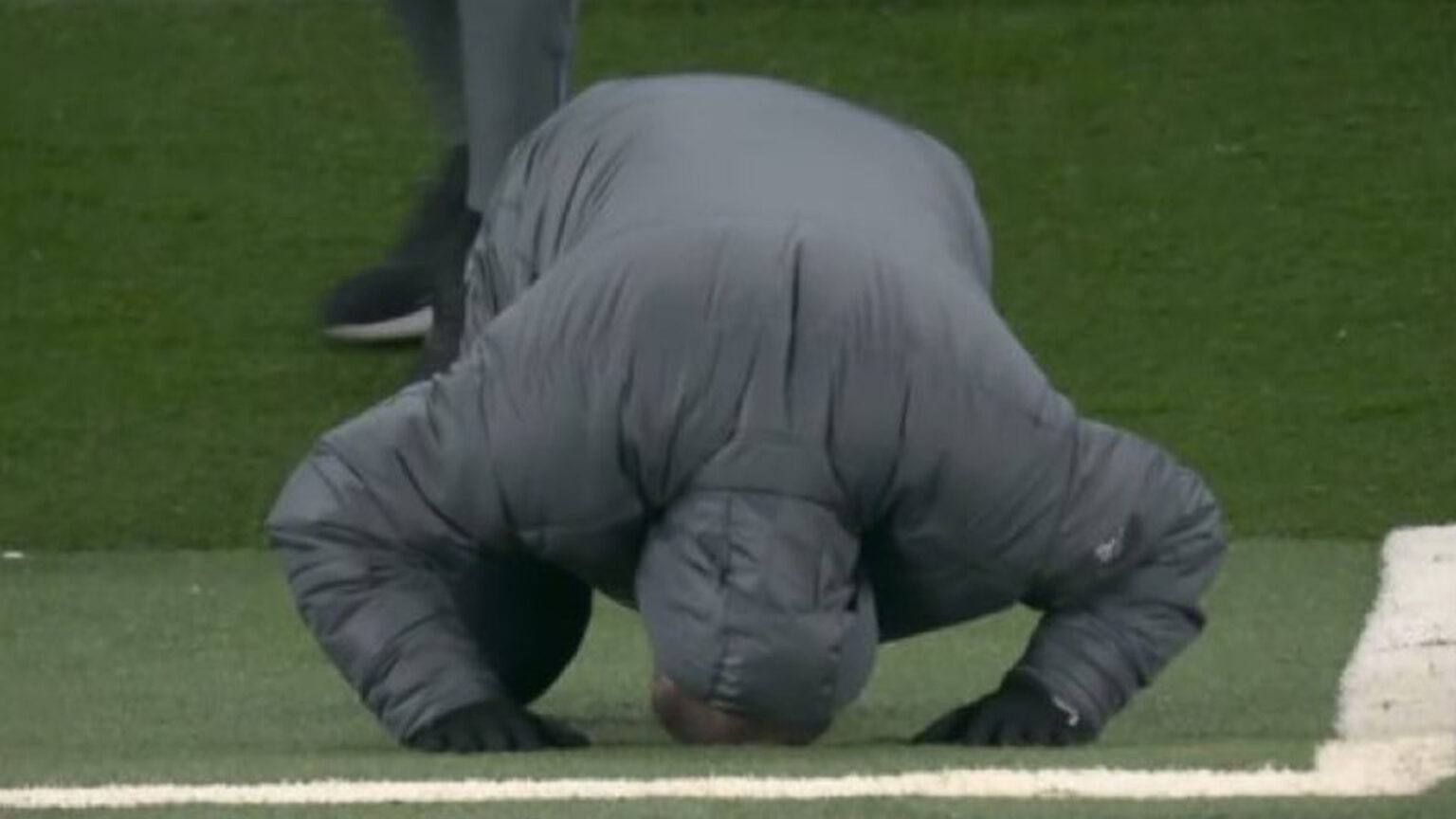 Ange Postecoglou falls to his knees in despair after Pedro Porro fails to convert golden chance against Liverpool