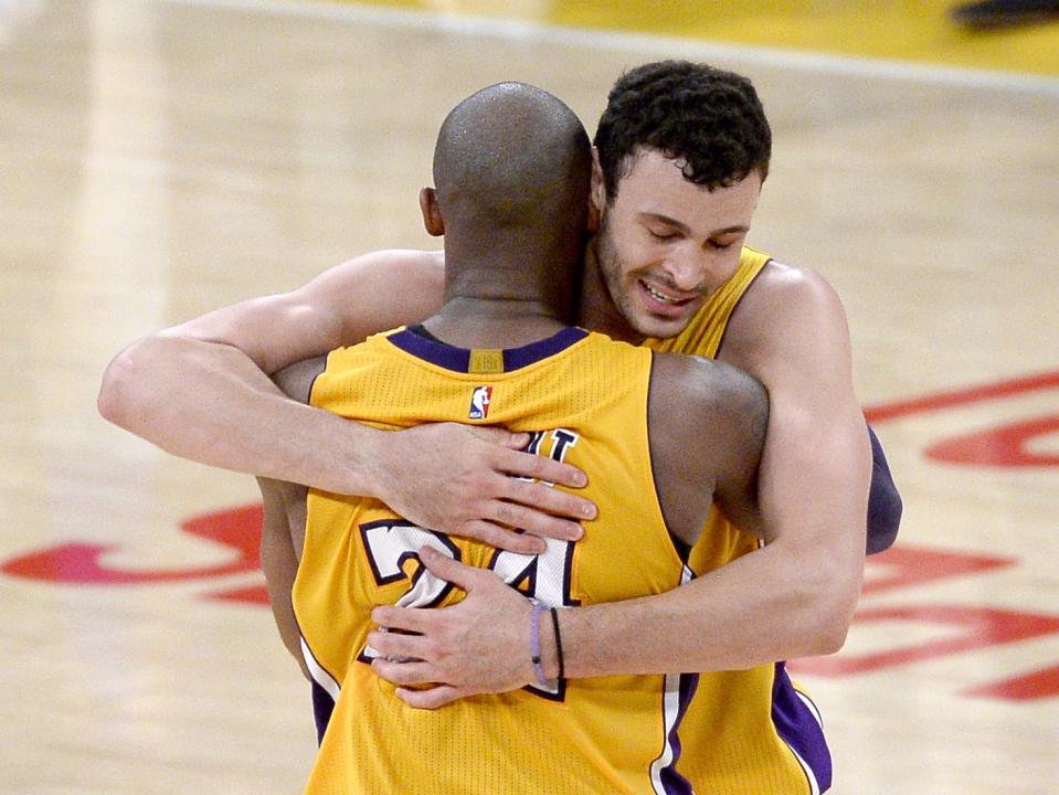 LOS ANGELES, CA - APRIL 13:  Kobe Bryant #24 of the Los Angeles Lakers hugs Larry Nance Jr. #7 after scoring 60 points against the Utah Jazz at Staples Center on April 13, 2016 in Los Angeles, California. Bryant played his last game as a Laker and retired from basketball.  (Photo by Kevork Djansezian/Getty Images)