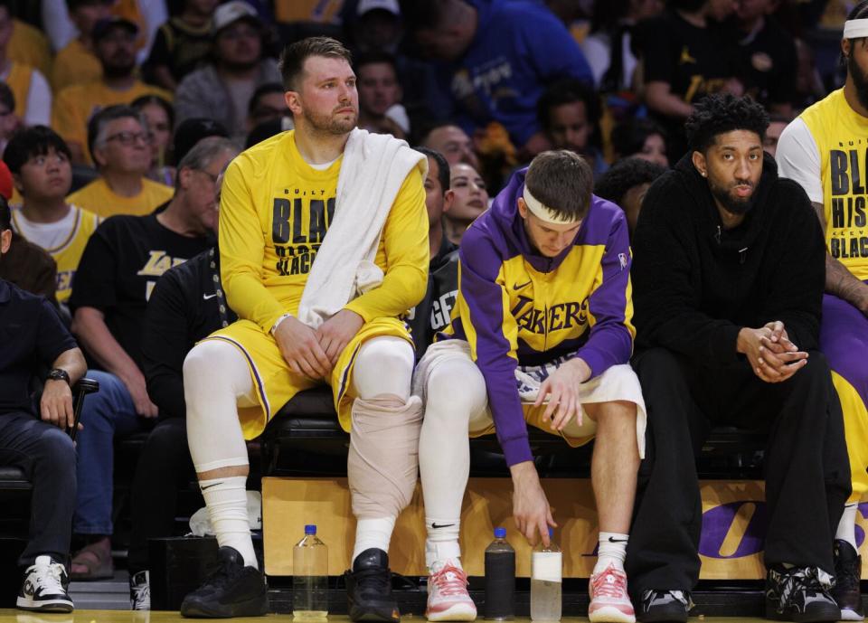 Lakers guard Luka Doncic sits on the bench during the first half of Monday's win over the Utah Jazz.