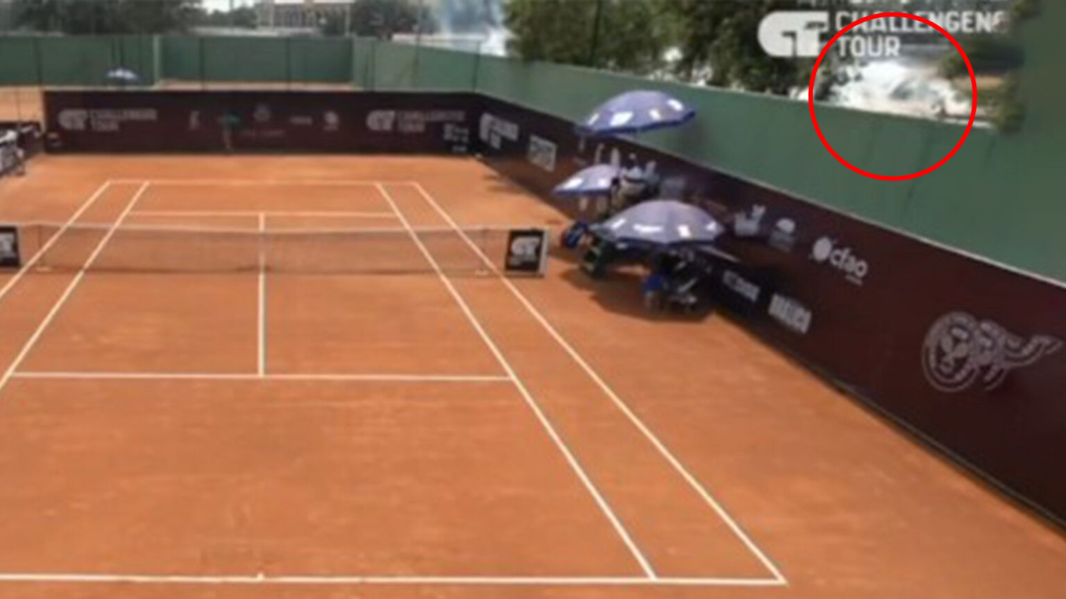 Shocking moment tennis match is suspended after shots are heard and gas deployed just metres from court