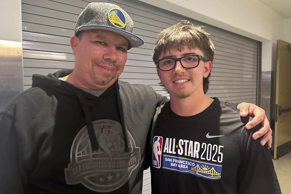 All-Star shooting contest winner Jaren Barajas, an 18-year-old college freshman from Oakley, right, poses with his father Michael after beating Damian Lillard in a three-point contest to win $100,000 at the All-Star Game on Sunday, Feb. 16, 2025, in San Francisco. (AP Photo/Janie McCauley)