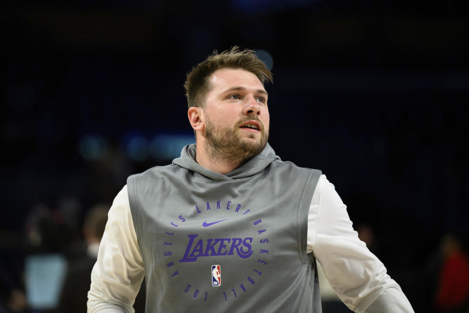 Los Angeles Lakers guard Luka Doncic looks on before an NBA basketball game against the Charlotte Hornets, Wednesday, Feb. 19, 2025, in Los Angeles. (AP Photo/William Liang)