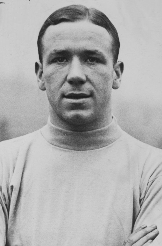 Black and white portrait of Sir Matt Busby.