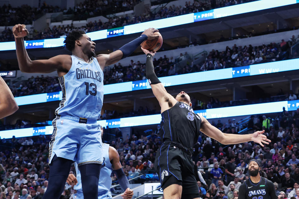 DALLAS, TEXAS - DECEMBER 01: Jaren Jackson Jr. #13 of the Memphis Grizzlies blocks the shot of Josh Green #8 of the Dallas Mavericks in the first half at American Airlines Center on December 01, 2023 in Dallas, Texas. NOTE TO USER: User expressly acknowledges and agrees that, by downloading and or using this photograph, User is consenting to the terms and conditions of the Getty Images License Agreement. (Photo by Tim Heitman/Getty Images)