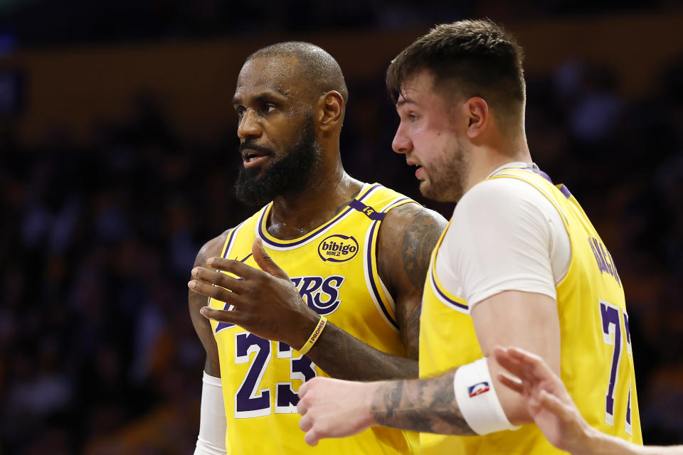 LOS ANGELES, CALIFORNIA - FEBRUARY 10: LeBron James #23 and Luka Doncic #77 of the Los Angeles Lakers talk during the third quarter of a game against the Utah Jazz at Crypto.com Arena on February 10, 2025 in Los Angeles, California.  NOTE TO USER: User expressly acknowledges and agrees that, by downloading and or using this photograph, User is consenting to the terms and conditions of the Getty Images License Agreement. (Photo by Ronald Martinez/Getty Images)