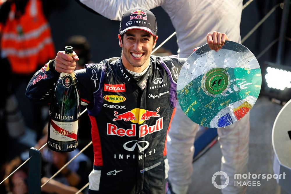 Daniel Ricciardo, Red Bull Racing, 2nd Position, on the podium with his trophy and champagne