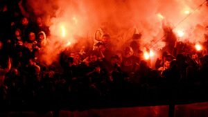 Istanbul derby SUSPENDED as Fenerbahce fans throw flares into Galatasaray end and police forced to intervene