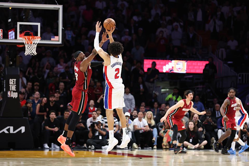 MIAMI, FLORIDA - MARCH 19: Cade Cunningham #2 of the Detroit Pistons shoots the game-winning basket against Bam Adebayo #13 of the Miami Heat for a 116-113 win at Kaseya Center on March 19, 2025 in Miami, Florida. NOTE TO USER: User expressly acknowledges and agrees that, by downloading and or using this photograph, User is consenting to the terms and conditions of the Getty Images License Agreement. (Photo by Megan Briggs/Getty Images)