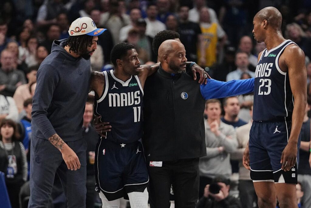 Mavericks star Kyrie Irving helped off the floor after awkward knee injury early in matchup with Kings