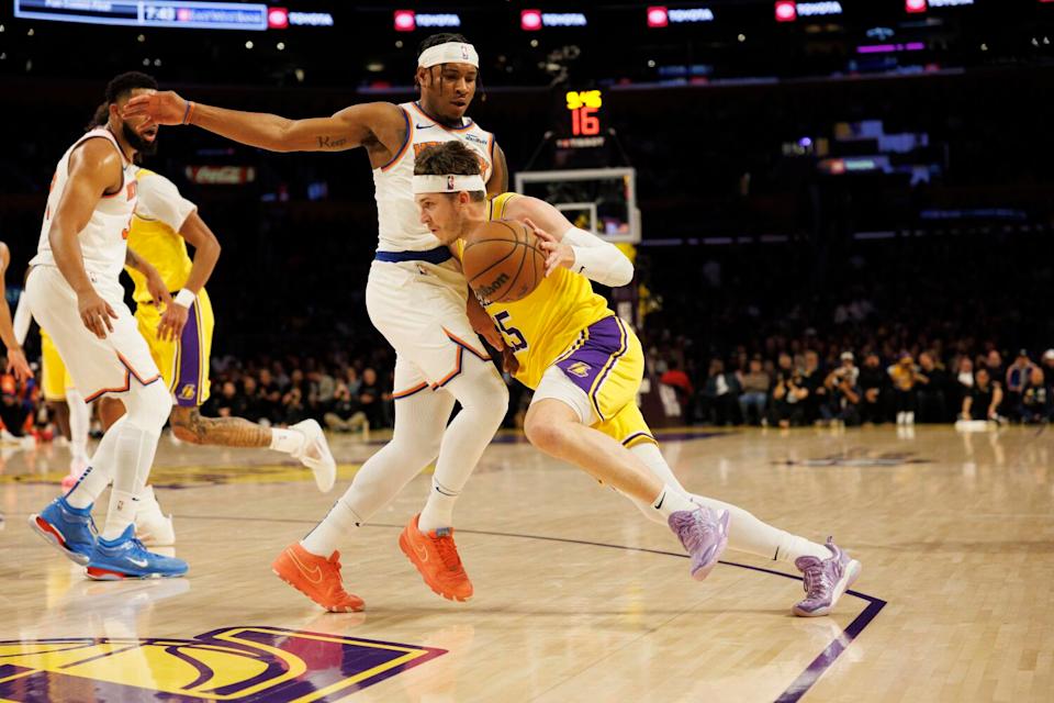 Lakers guard Austin Reaves tries to drive around New York Knicks guard Miles McBride in the first half Thursday.