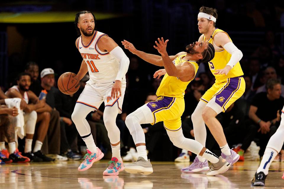 Lakers guard Gabe Vincent reacts as he defends against New York Knicks guard Jalen Brunson (11) in the first half.