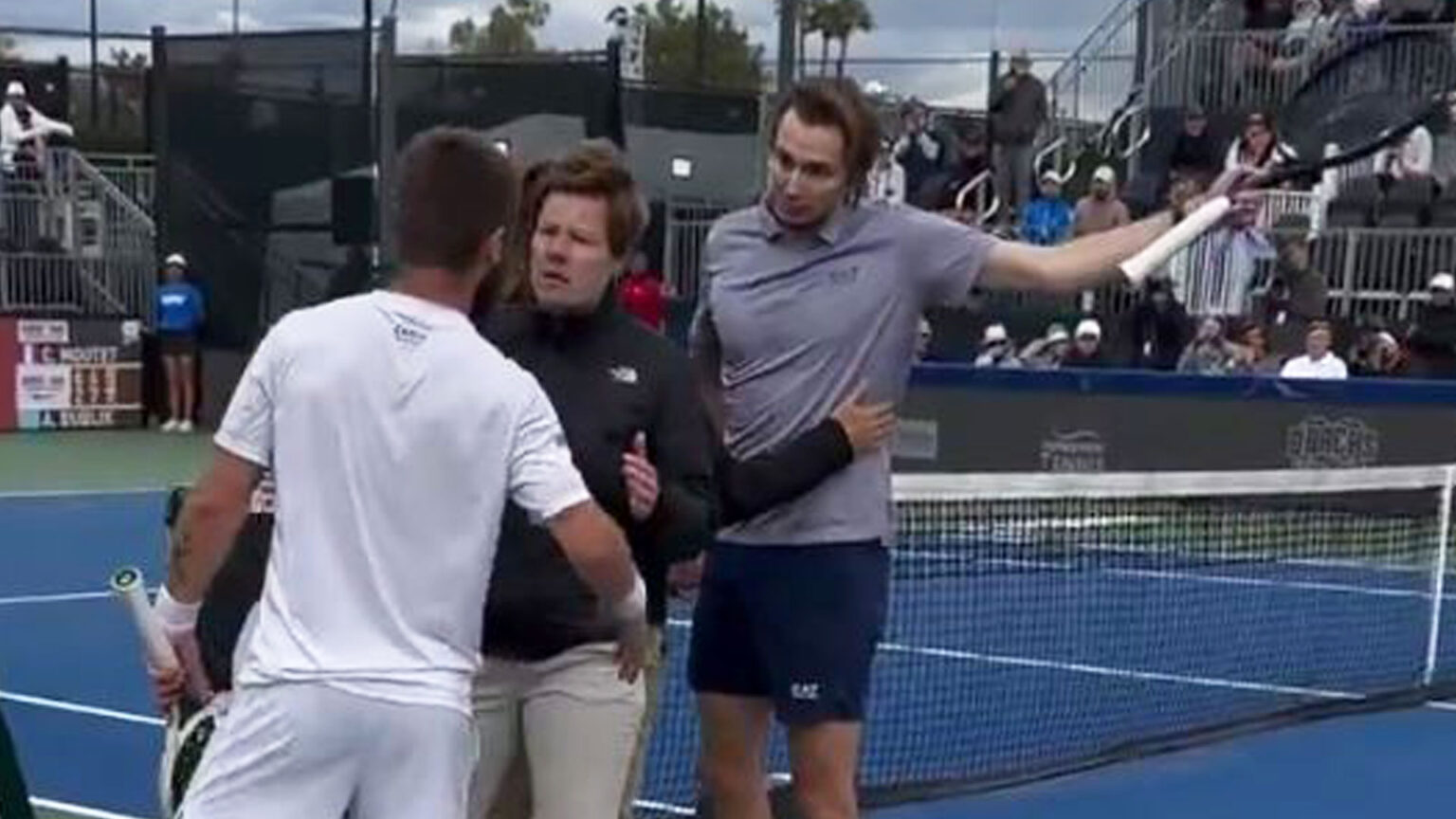 Shocking moment tennis stars have to be separated as one tells rival to ‘meet me outside’ for fight after heated match