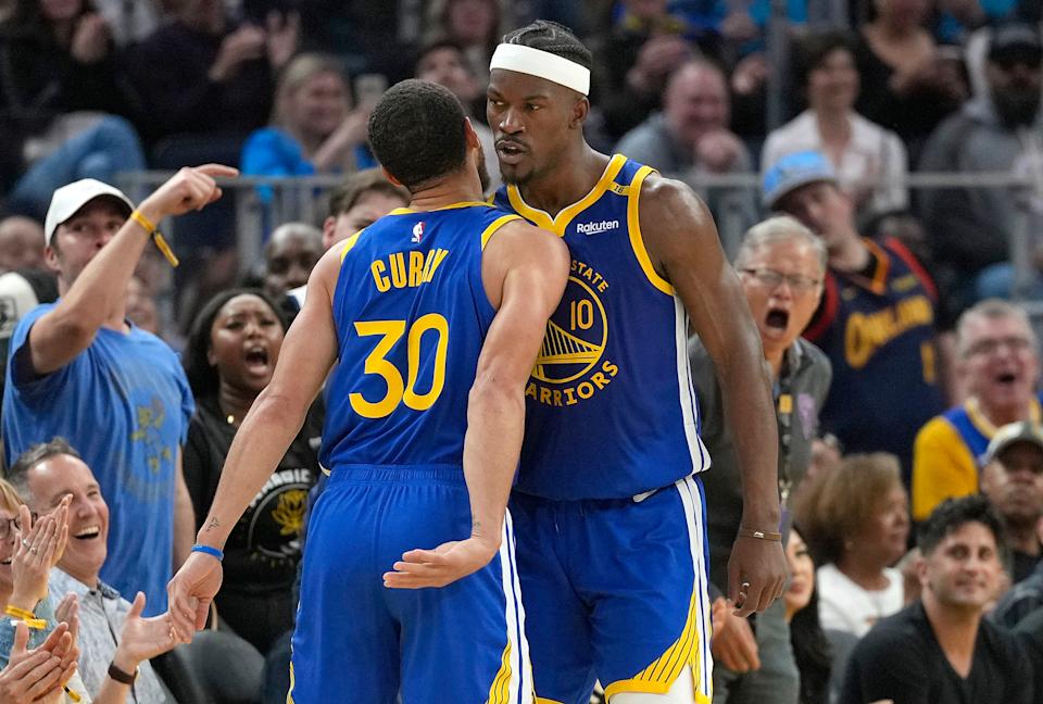 SAN FRANCISCO, CALIFORNIA - FEBRUARY 23: Jimmy Butler III #10 and Stephen Curry #30 of the Golden State Warriors celebrates after Butler scores and was fouled on the shot against the Dallas Mavericks during the first half of an NBA basketball game at Chase Center on February 23, 2025 in San Francisco, California. NOTE TO USER: User expressly acknowledges and agrees that, by downloading and or using this photograph, User is consenting to the terms and conditions of the Getty Images License Agreement. (Photo by Thearon W. Henderson/Getty Images)