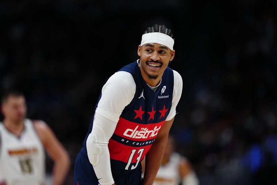 Mar 15, 2025; Denver, Colorado, USA; Washington Wizards guard Jordan Poole (13) reacts back towards the Denver Nuggets bench in the first quarter at Ball Arena. Mandatory Credit: Ron Chenoy-Imagn Images