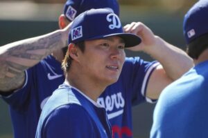 Yoshinobu Yamamoto stays in line to pitch opening day for the Dodgers in Tokyo