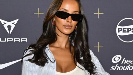 Watch as Maya Jama finally confirms Ruben Dias romance with kiss, cuddle and bite to neck at footy match