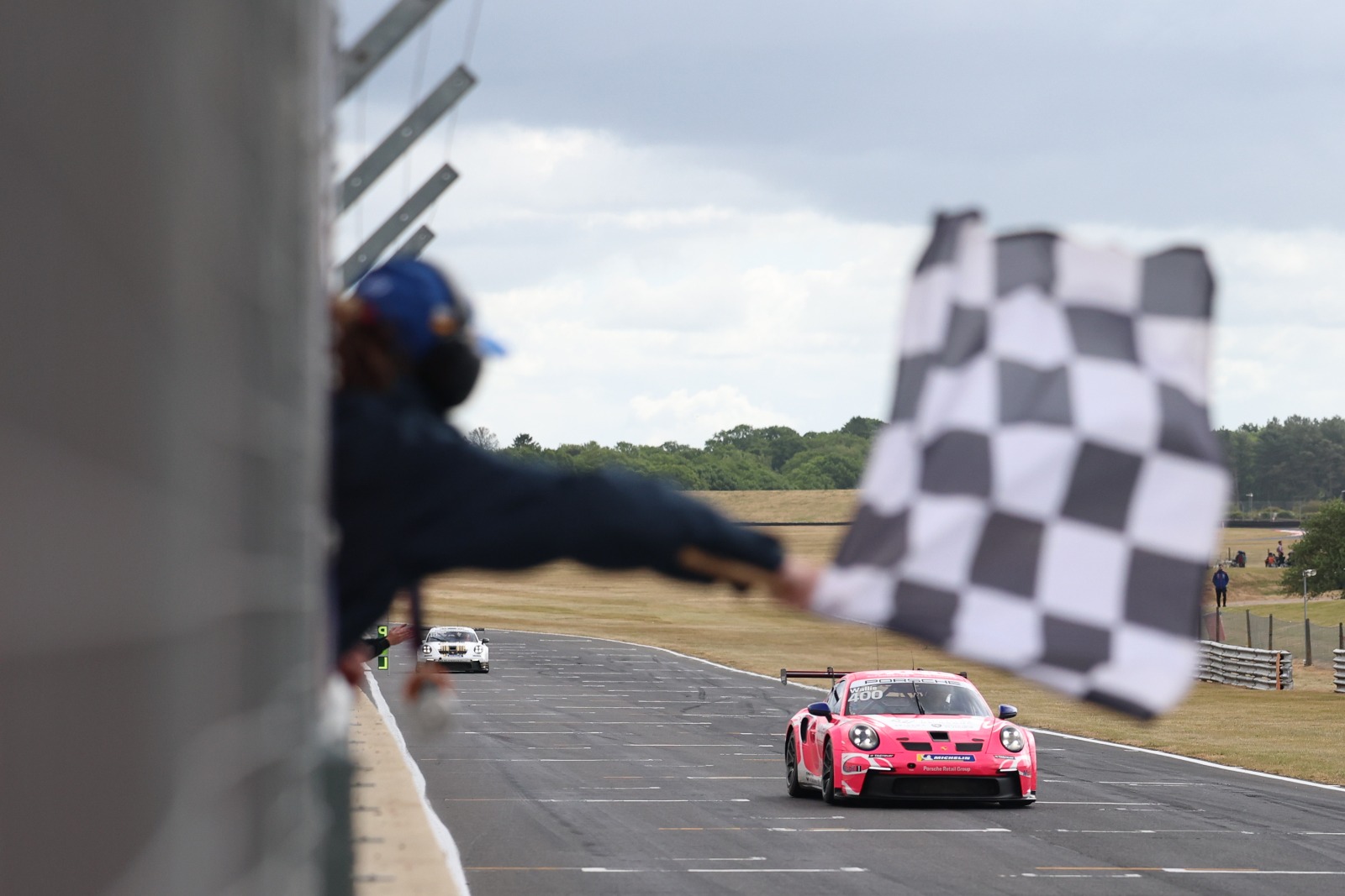 Porsche GB Junior Wallis achieved his maiden victory