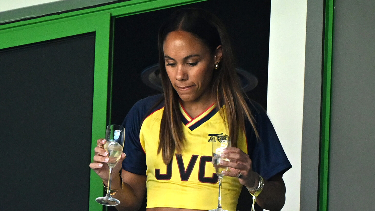 Alex Scott shows off midriff in retro Arsenal kit and sips bubbly with Jess Glynne at Women’s Champions League final