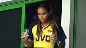 Alex Scott shows off midriff in retro Arsenal kit and sips bubbly with Jess Glynne at Women’s Champions League final