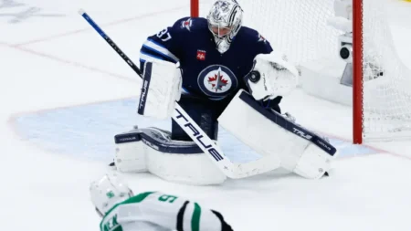 Jets goalie Connor Hellebuyck’s road playoff stats are historically bad, but he has shot at redemption