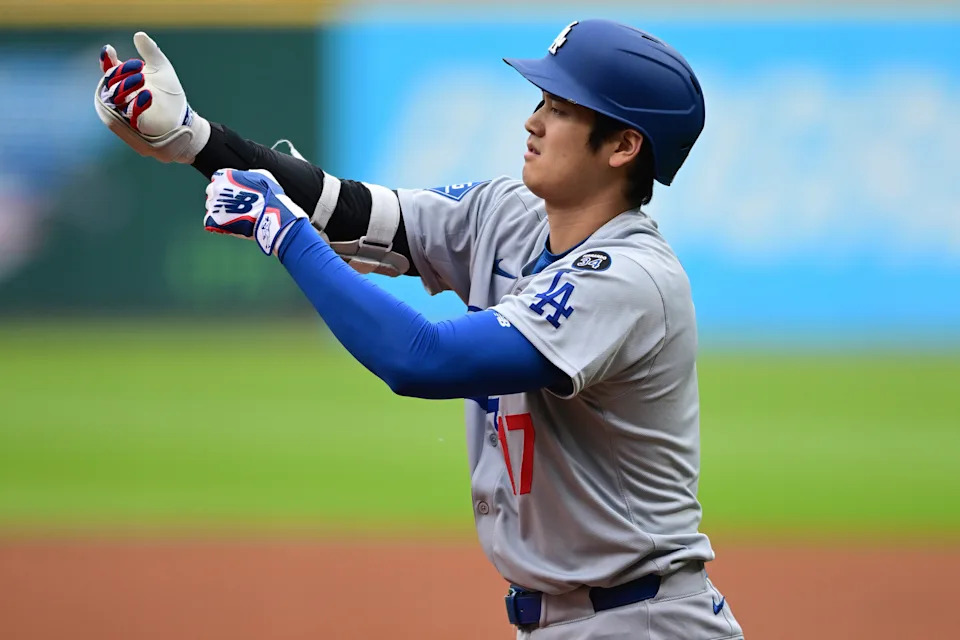 Los Angeles Dodgers' Shohei Ohtani adjusts his batting gloves during the first inning of a baseball game against the Cleveland Guardians, Tuesday, May 27, 2025, in Cleveland. (AP Photo/David Dermer)