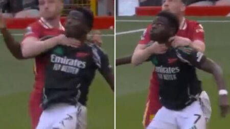 Arsenal fans furious as Bukayo Saka ‘chokeslammed’ by Andy Robertson but VAR fails to intervene