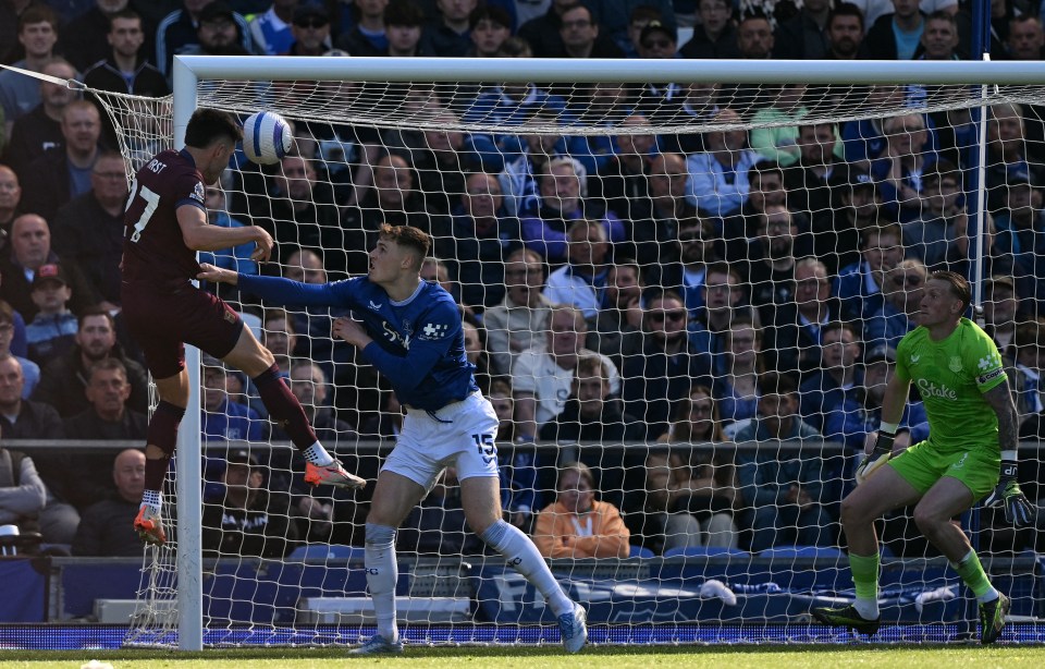 A soccer player scoring a goal.