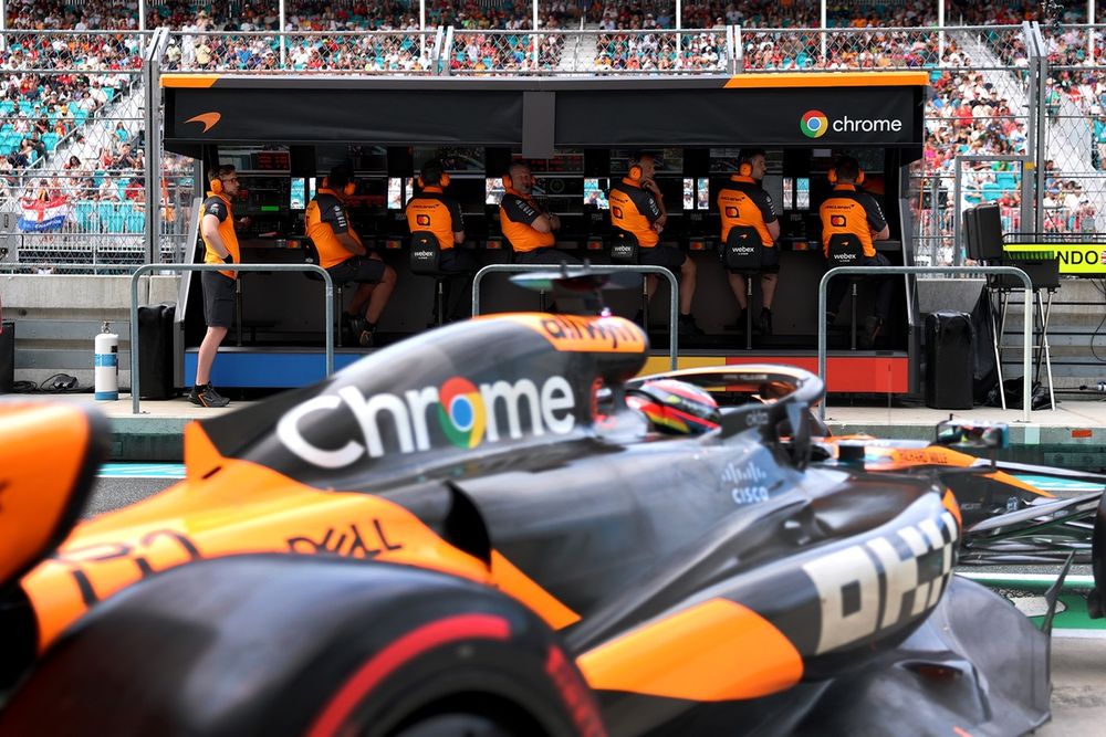 Zak Brown, Chief Executive Officer of McLaren and McLaren engineers