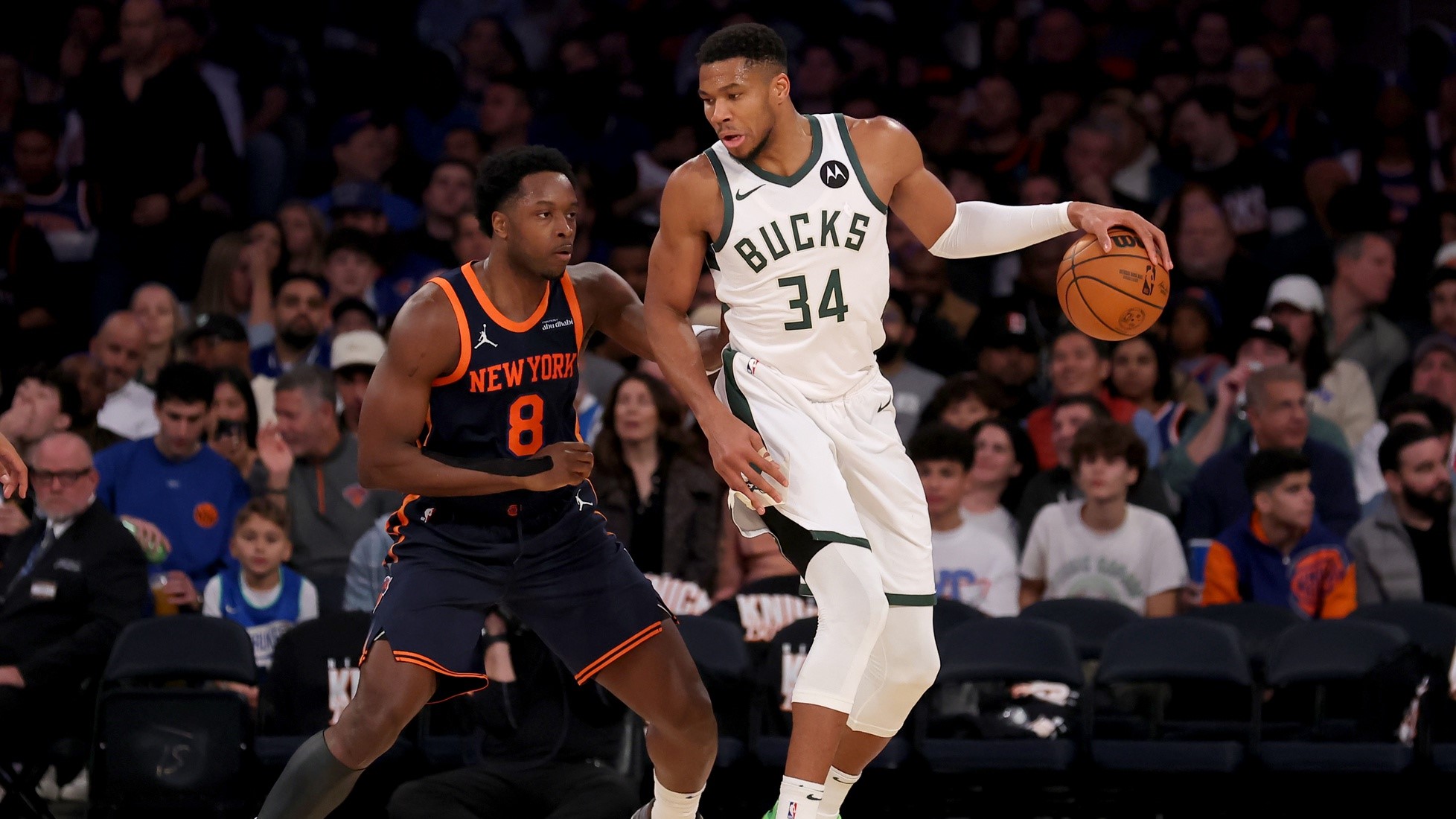 Nov 8, 2024; New York, New York, USA; Milwaukee Bucks forward Giannis Antetokounmpo (34) controls the ball against New York Knicks forward OG Anunoby (8) during the third quarter at Madison Square Garden.