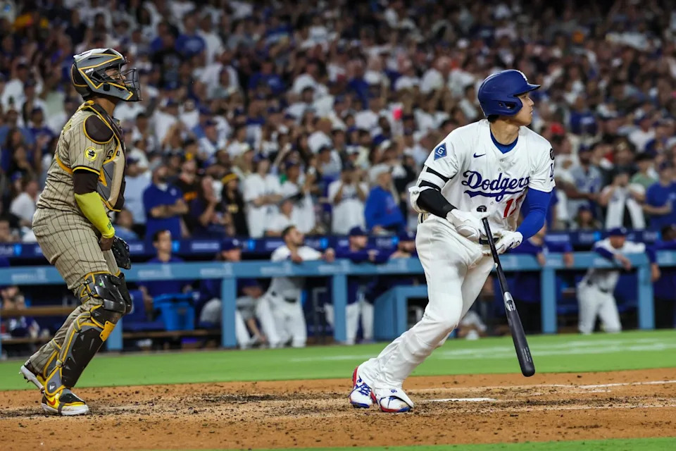 Shohei Ohtani hits a run-scoring single in the fourth inning against the Padres on Monday.