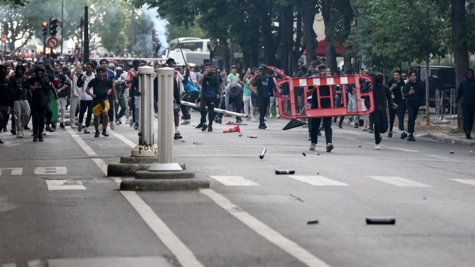 Chaos erupts in Paris as riot cops clash with PSG fans at Champions League victory parade in second night of violence