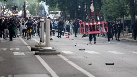 Chaos erupts in Paris as riot cops clash with PSG fans at Champions League victory parade in second night of violence