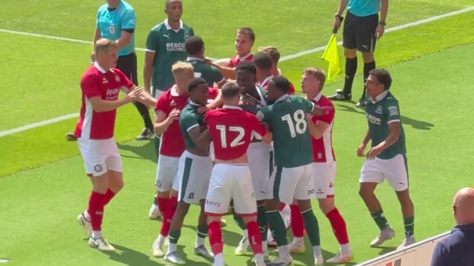 Pre-season clash descends into huge brawl with League One star shoved to floor in tense clash