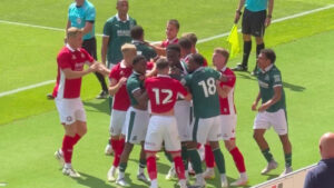 Pre-season clash descends into huge brawl with League One star shoved to floor in tense clash