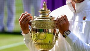 Why is there a pineapple on the top of the Wimbledon trophy?