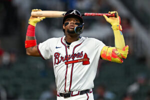 Ronald Acuña Jr. leaves in middle of Braves-Royals inning with Achilles tightness after struggling to run down deep fly ball