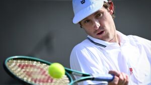 Why does Nicolas Jarry wear a plaster on his nose?