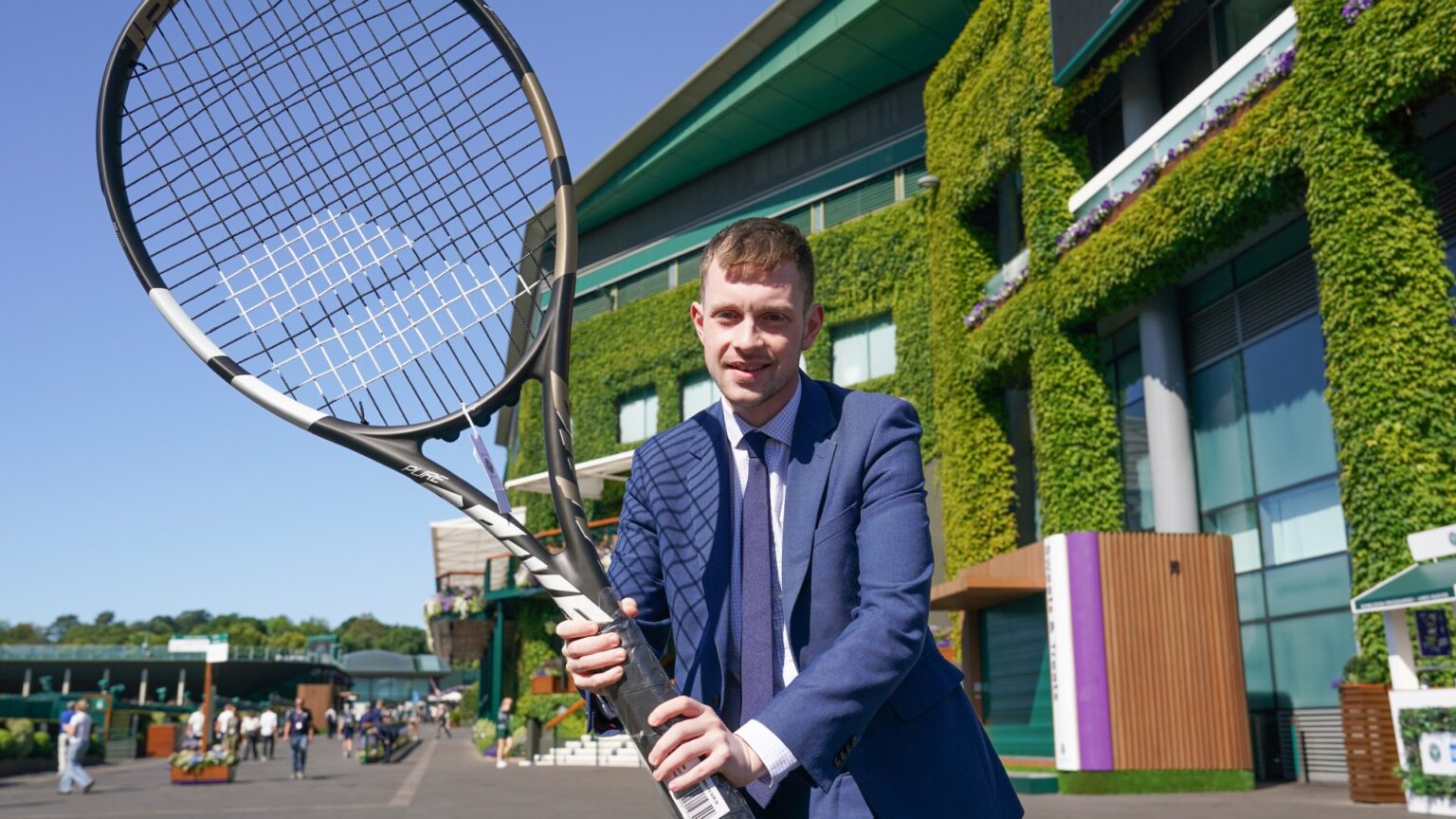 Wimbledon superfans fork out £600 on giant tennis racquet – even though it would fall apart if they used it