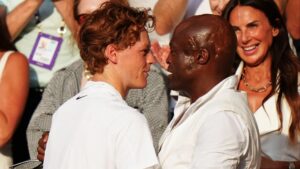 Jannik Sinner hugs British music legend before his own MUM after winning Wimbledon title against Carlos Alcaraz