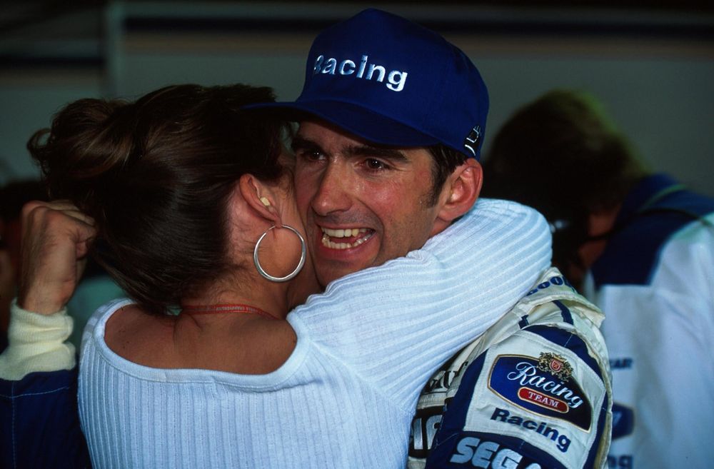 Damon and his wife Georgie celebrate pole position - but the main test was to come on Sunday